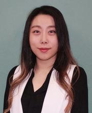 headshot photo of Dr. Hannarae Lee with long dark brown hair, wearing a black v-neck long sleeve top with a light pink vest